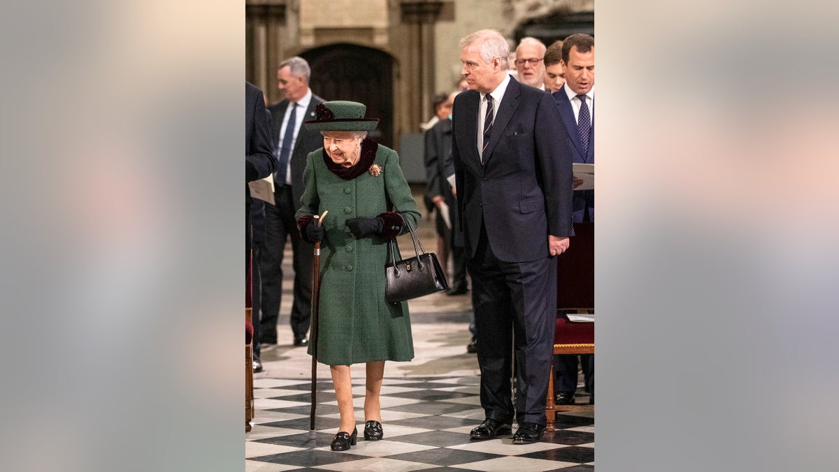 Prince Andrew walking alongside his mother Queen Elizabeth II in church