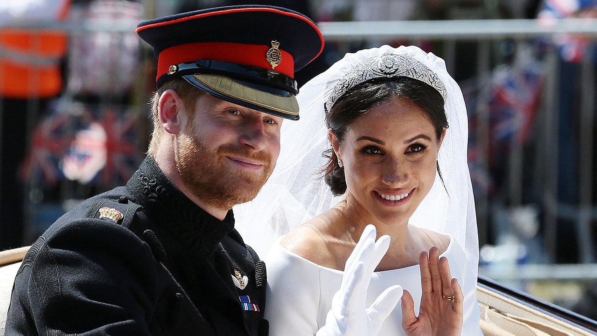 Prince Harry and Meghan Markle waving on their wedding day