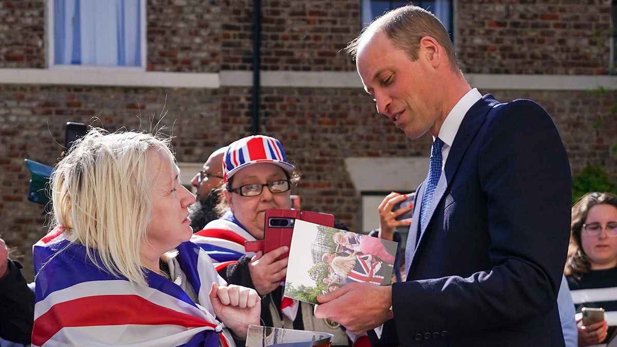 Prince William being greeted by good wishers