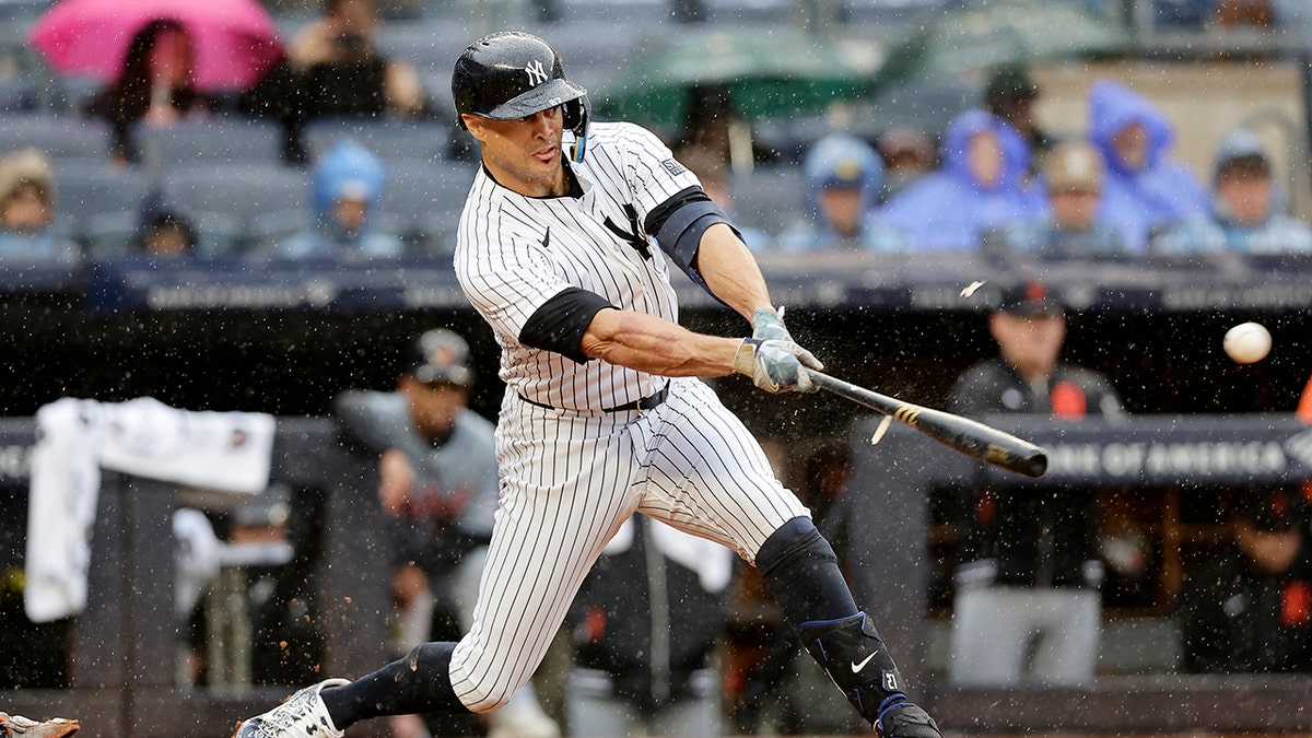 Giancarlo Stanton swings