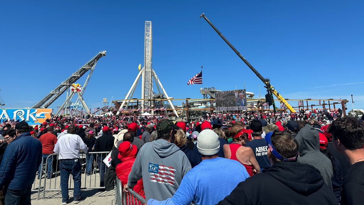 A large crowd lines up prior to former President Trump's campaign rally in Wildwood, Saturday.
