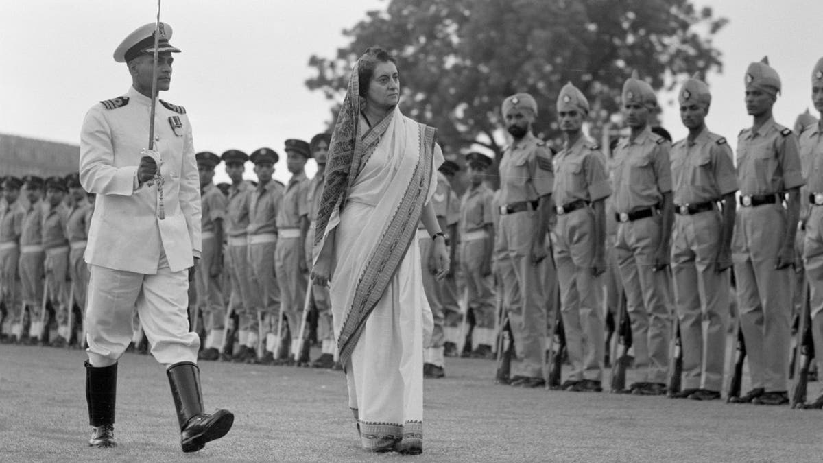 Indira walking during the Inspecting Guard of Honor ceremony