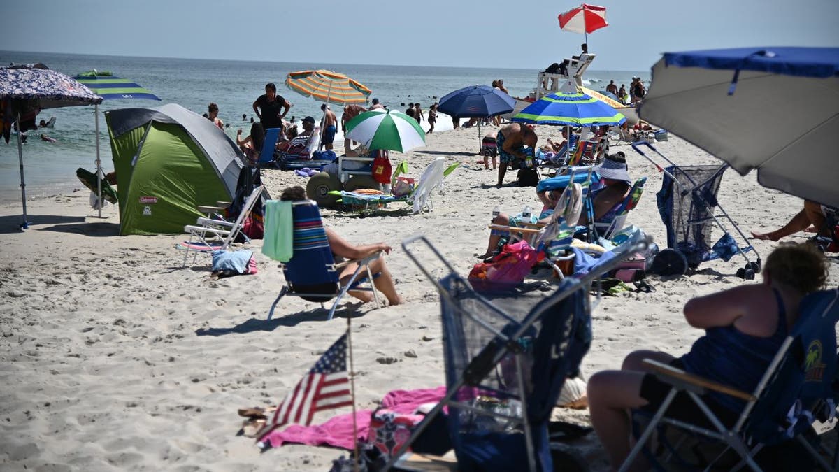 A New Jersey beach full with tents and beach chairs