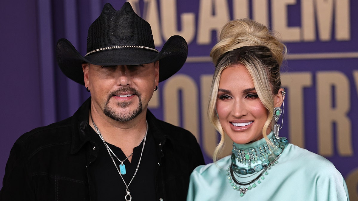 Jason Aldean and wife Brittany attend an event