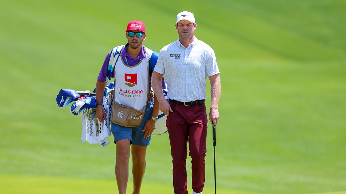 Grayson Murray and Jay Green walk on golf course