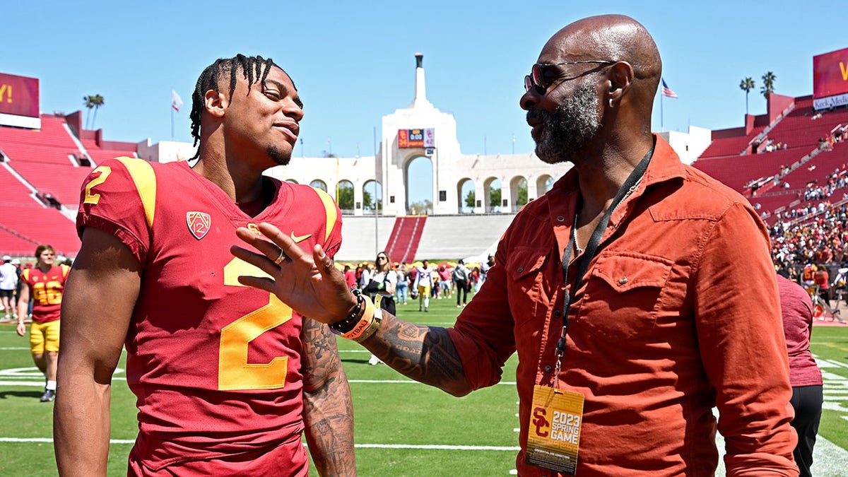 Jerry Rice talks with his son