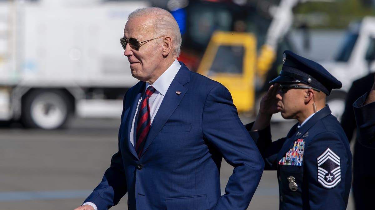 President Joe Biden walks on the tarmac as he arrives on Air Force One at Seattle-Tacoma International Airport.