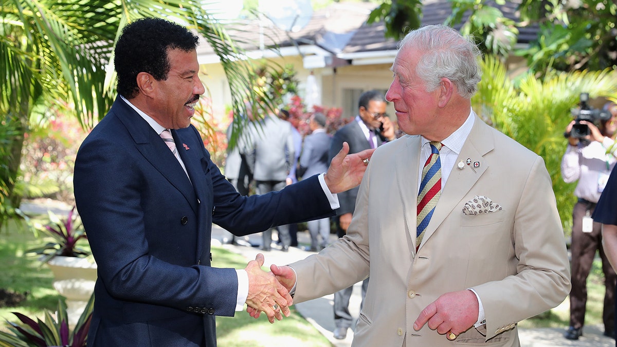 Lionel Richie shakes King Charles' hand