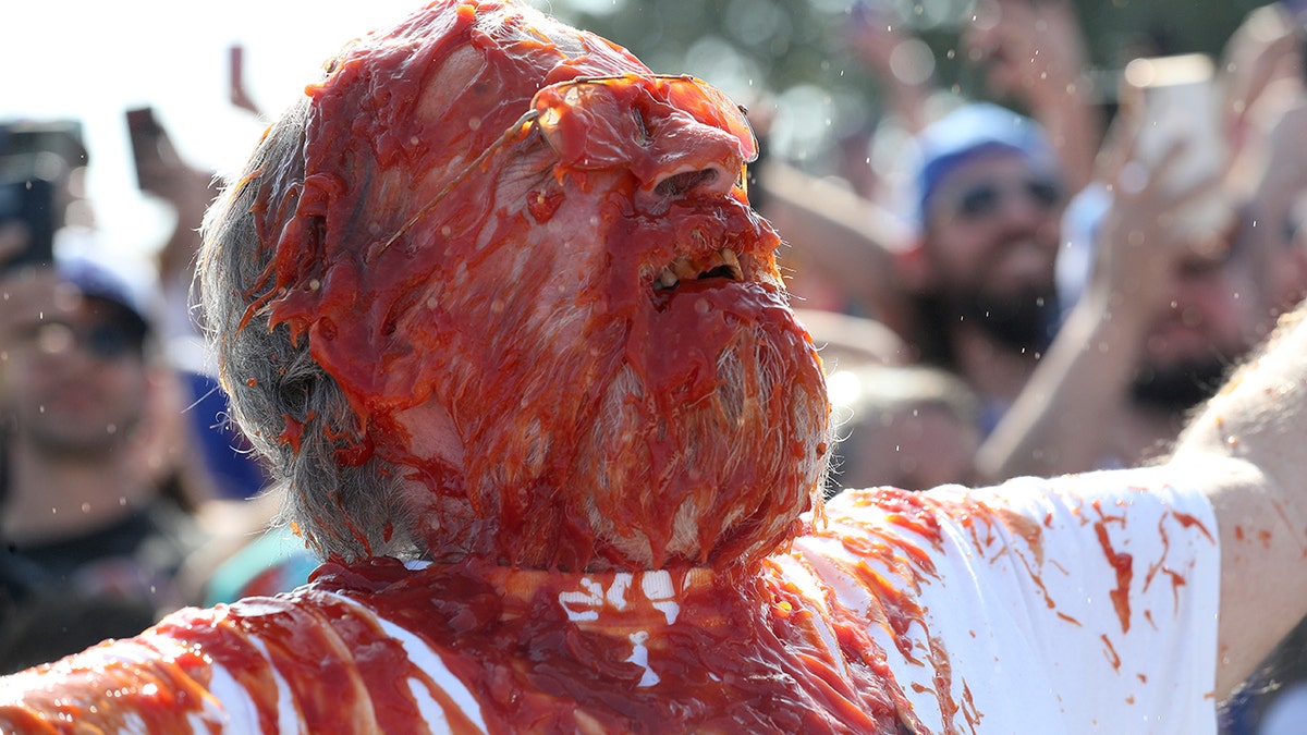Fan covered in ketchup