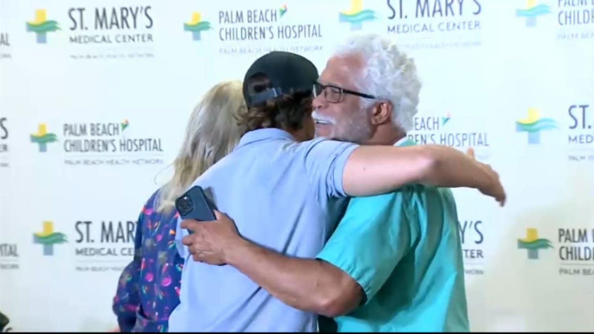 Marlin Wakeman hugs his surgeon