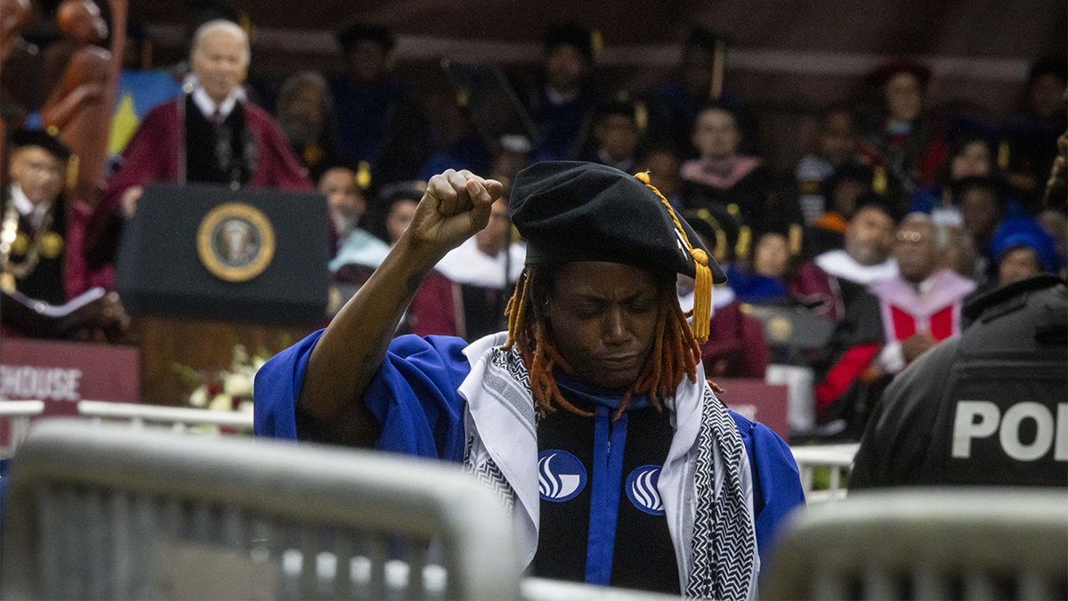 Graduating student raising fist