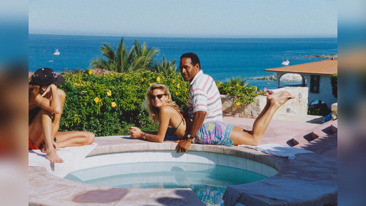 Nicole Brown Simpson and OJ Simpson at the poolside
