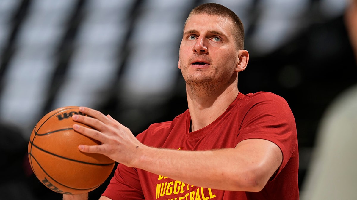 Nikola Jokic warms up