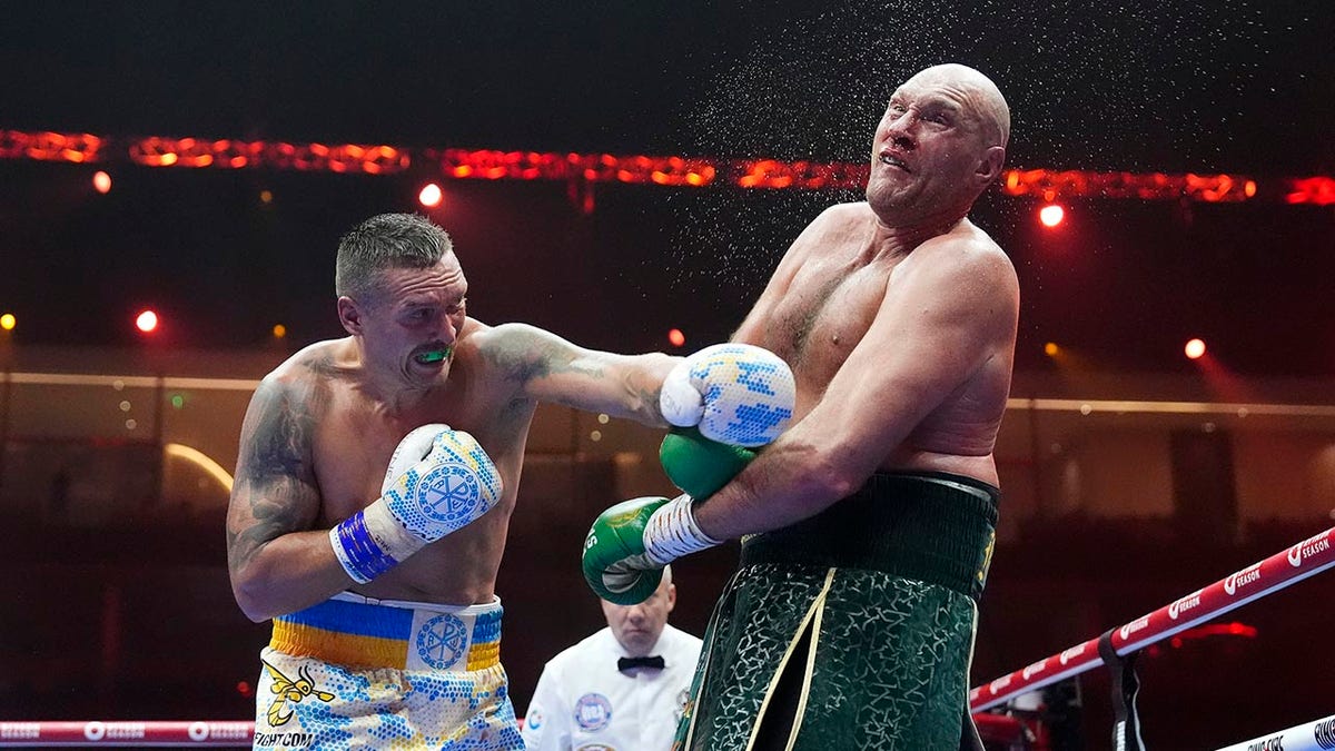 Oleksandr Usyk punches Tyson Fury