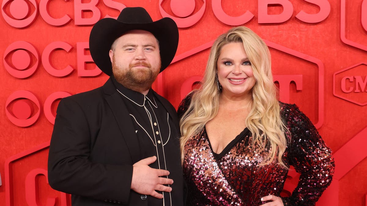 Paul Walter Hauser with wife Amy Elizabeth Boland at 2024 CMT Awards.