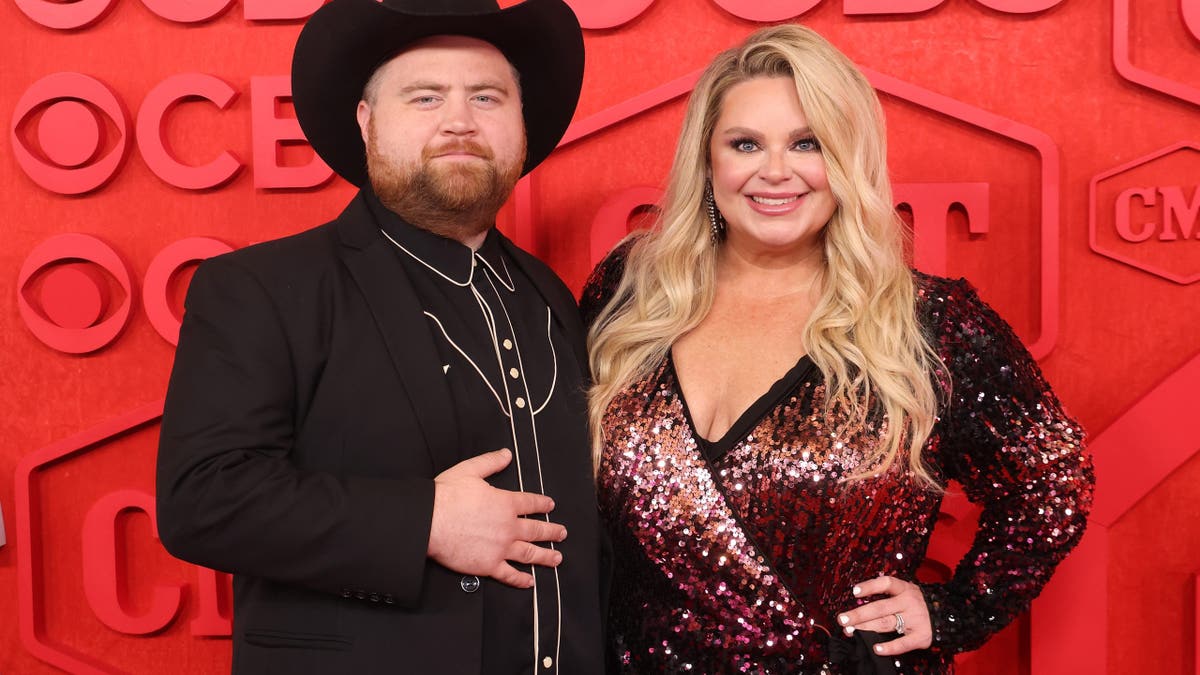 Paul Walter Hauser with wife Amy Elizabeth Boland at 2024 CMT Awards.