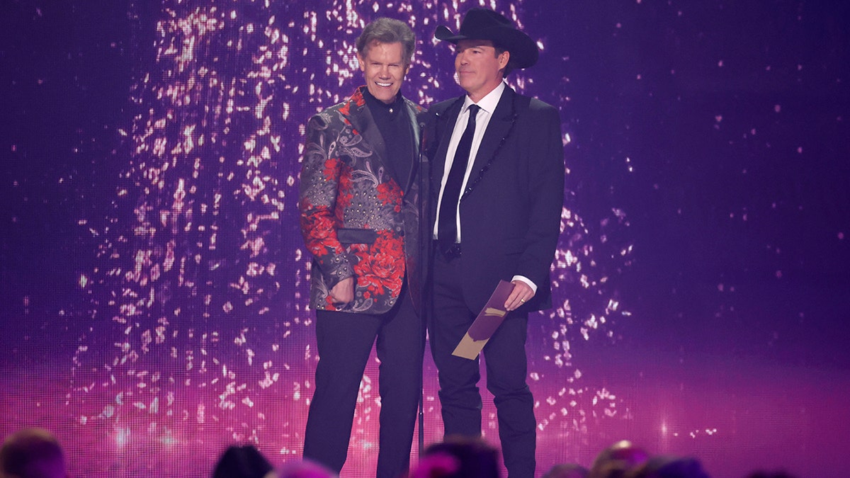 Randy Travis and Clay Walker on stage at the ACMs