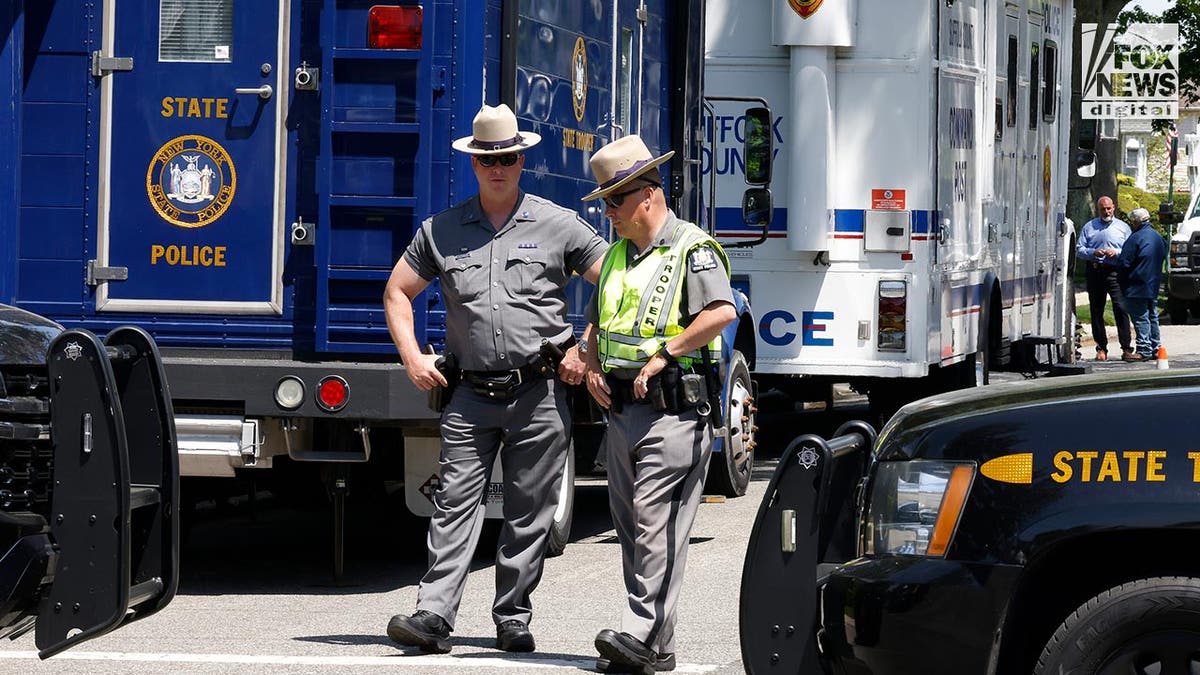 Police outside of a suburban home