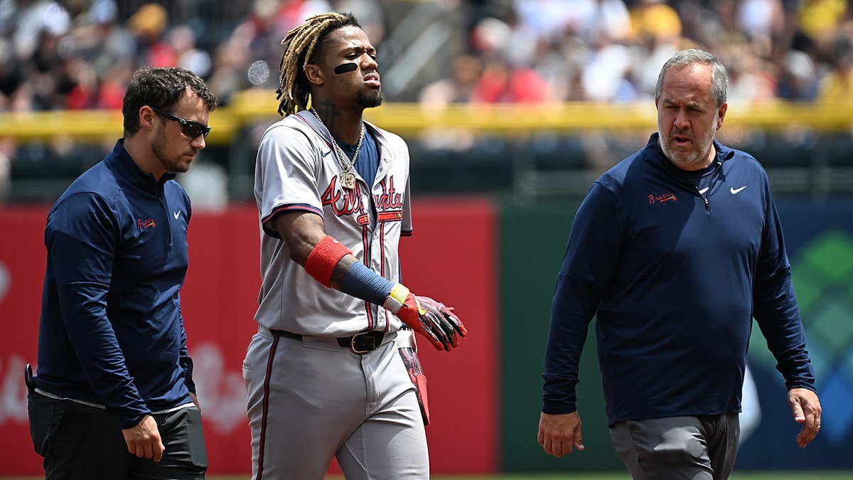 Ronald Acuña Jr walks off field with trainers