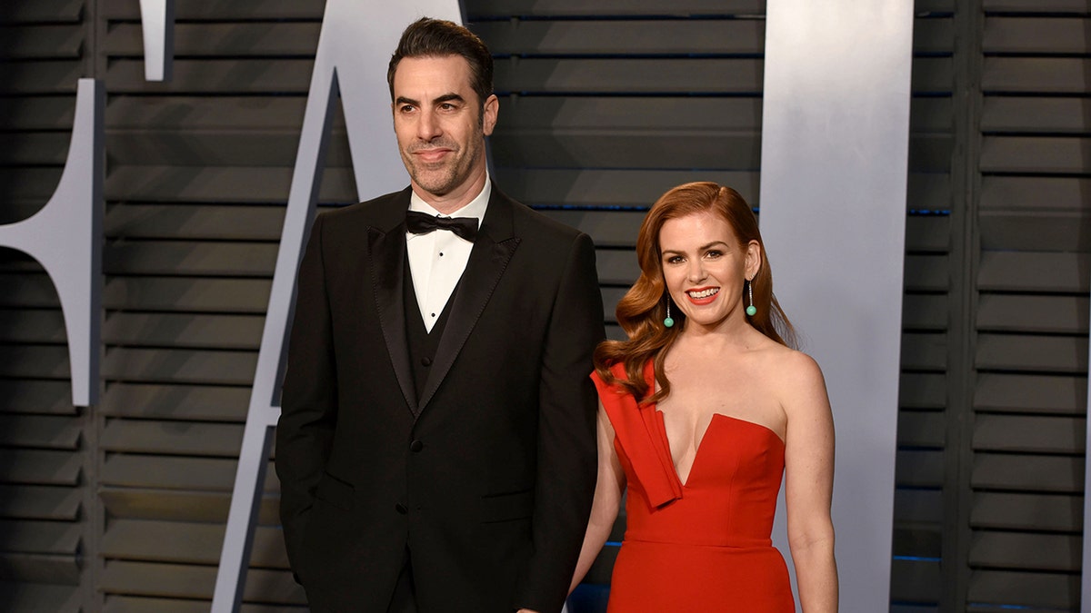 Sacha Baron Cohen and Isla Fisher arrive at an awards show event
