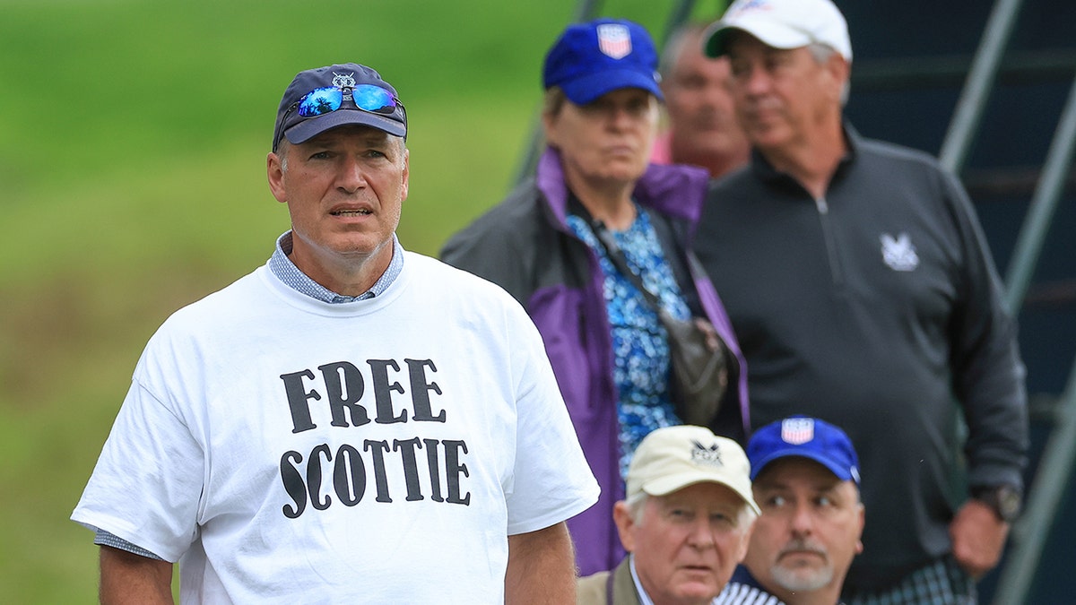 Fan in a 'Free Scottie' T-shirt
