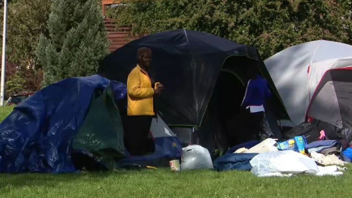 refugee outside tent in Seattle