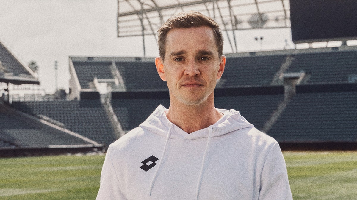 Former U.S. men's national team member Stu Holden looks into camera