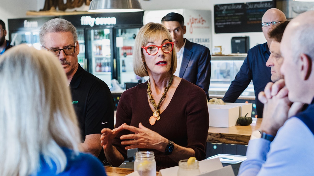 Suzanne Crouch talking with radical   successful  diner