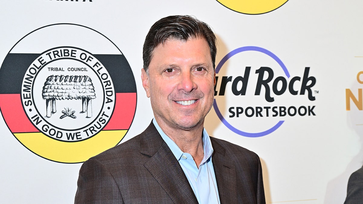 Tino Martinez smiles on red carpet