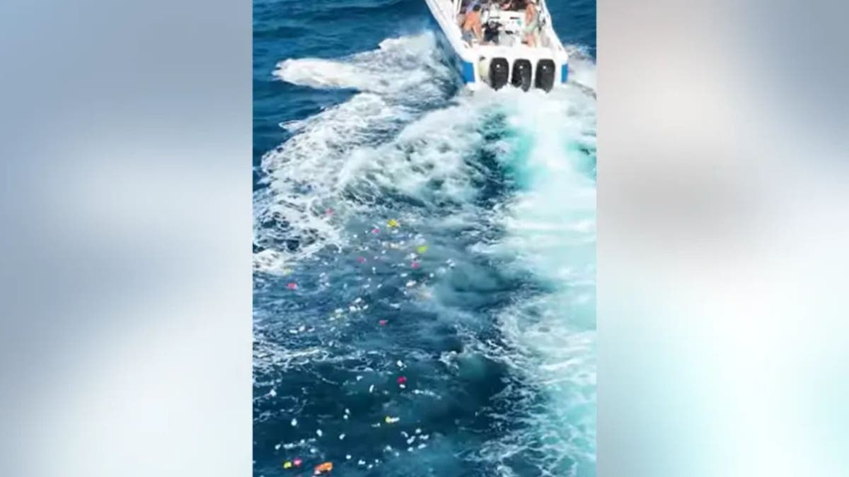 Trail of trash behind boat in Florida