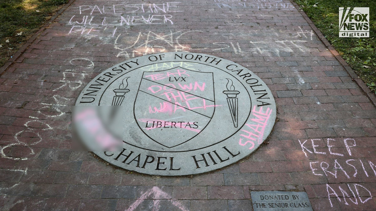 The University of North Carolina Chapel Hill’s seal is covered in graffiti