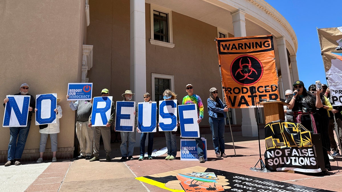 Protesters gather outside the New Mexico Statehouse to denounce a proposed rule for the treatment and recycling of oil-industry fracking water