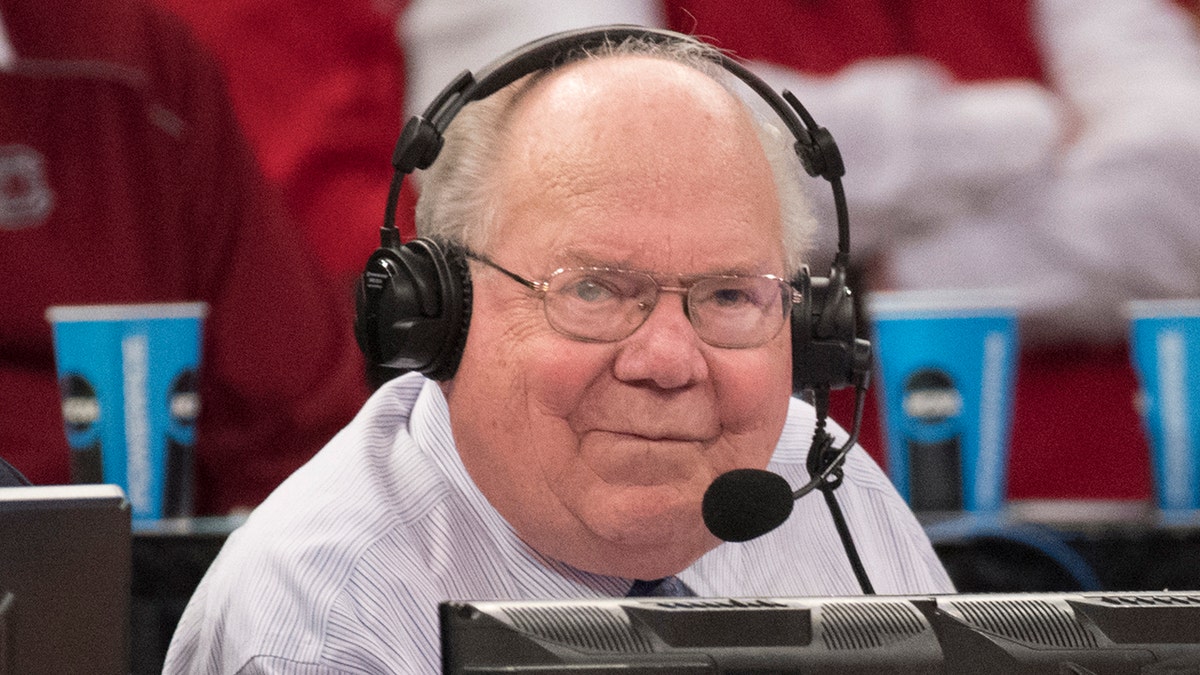 Verne Lundquist with headphones on