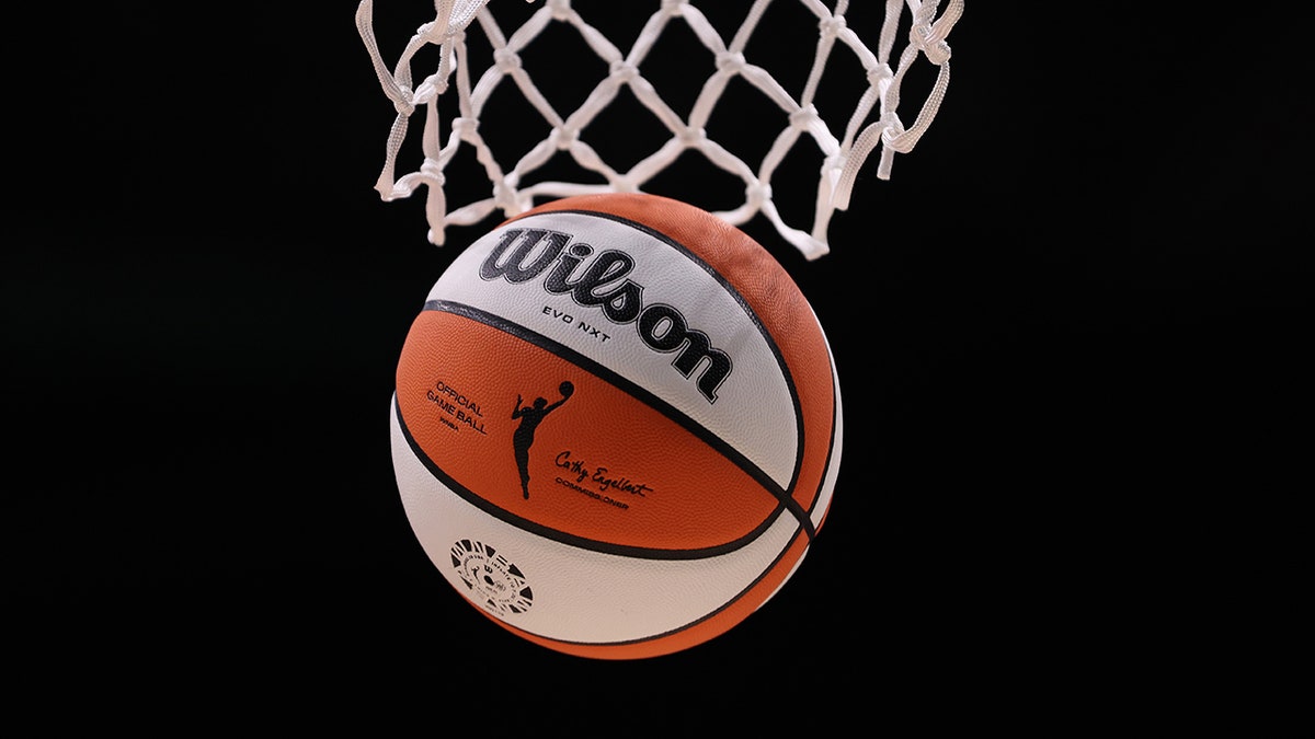 WNBA ball goes through hoop