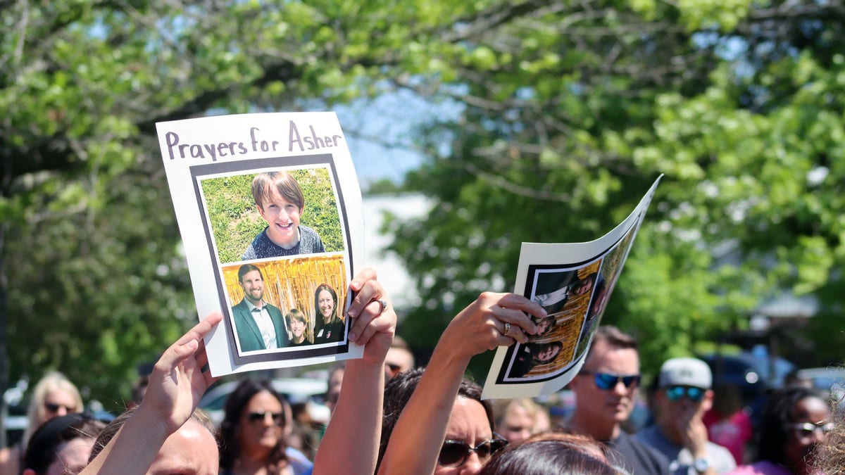 Over 500 people attended a prayer vigil for 10-year-old Asher Sullivan, who is fighting for his life after being pulled into a storm drain in a freak incident.