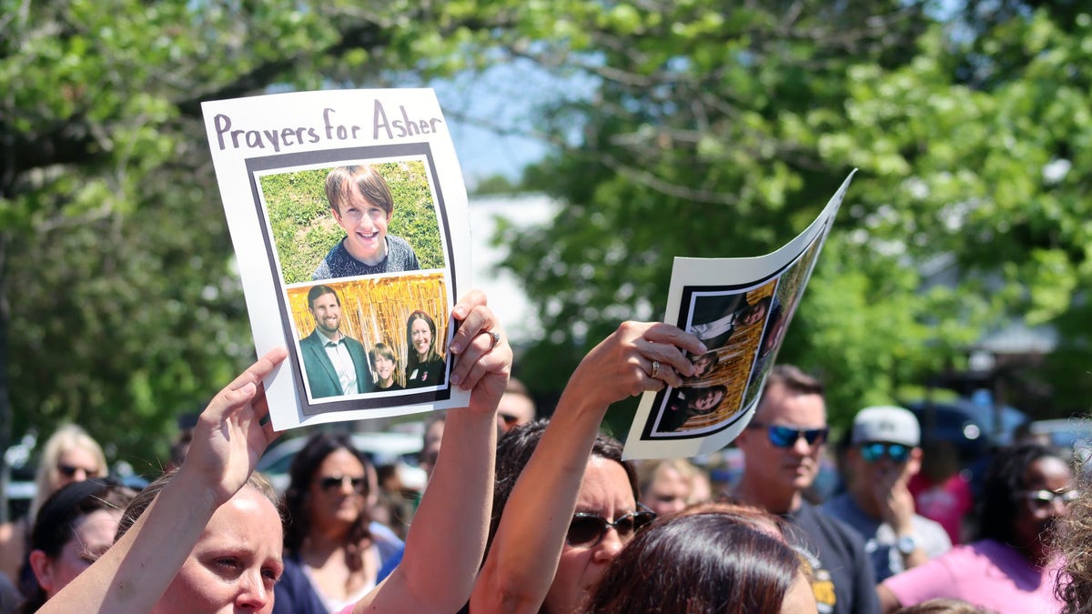 Over 500 people attended a prayer vigil for 10-year-old Asher Sullivan, who is fighting for his life after being pulled into a storm drain in a freak incident.
