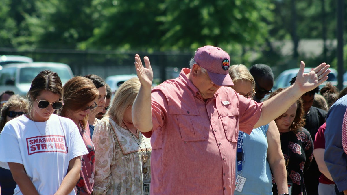 Community members prayed for Asher Sullivan during a vigil on Thursday. 