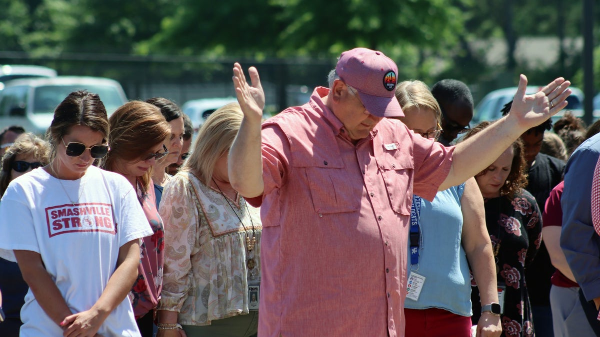 Community members prayed for Asher Sullivan during a vigil on Thursday.