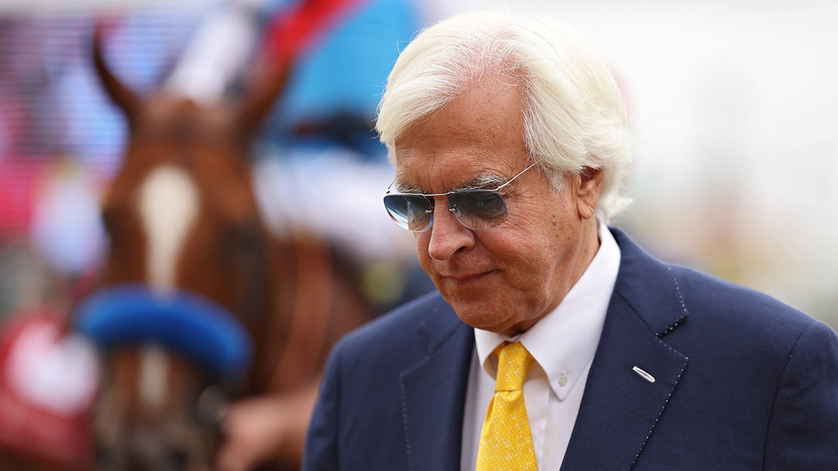 Bob Baffert looks on