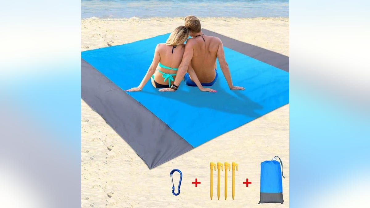 Add a blanket to keep the sand away.