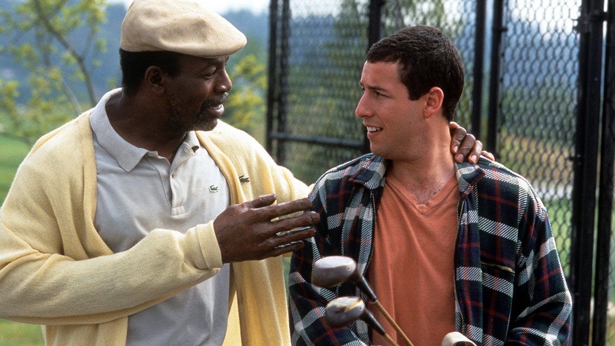 Carl Weathers and Adam Sandler in a scene from "Happy Gilmore" 