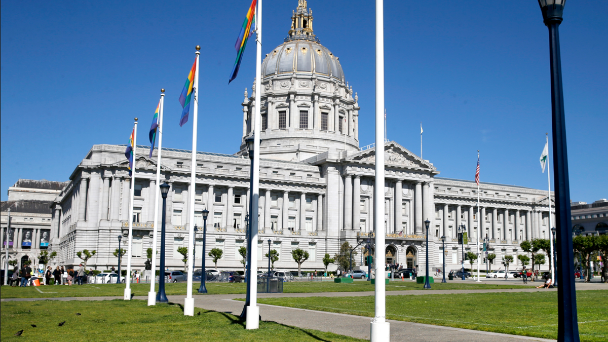 San Francisco City Hall with gay pride flags on flagpoles
