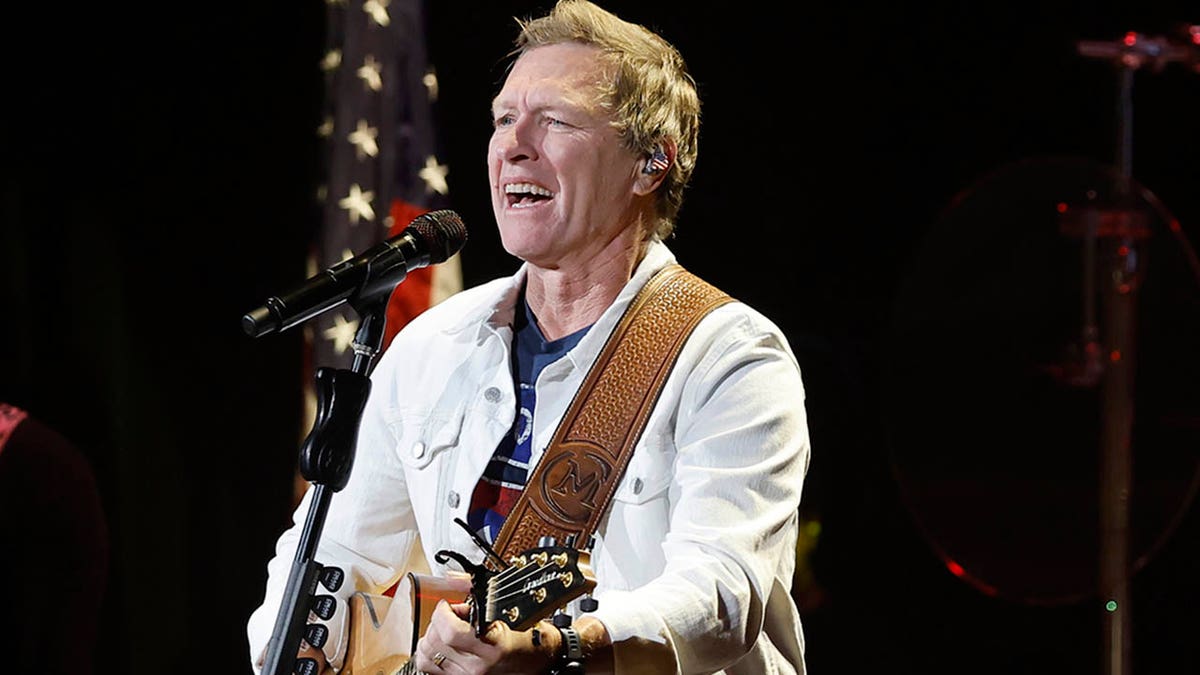 craig morgan performing in front of an american flag