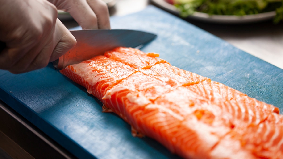 Cut through the center of the salmon filets to create an opening for your delicious crab to rest.