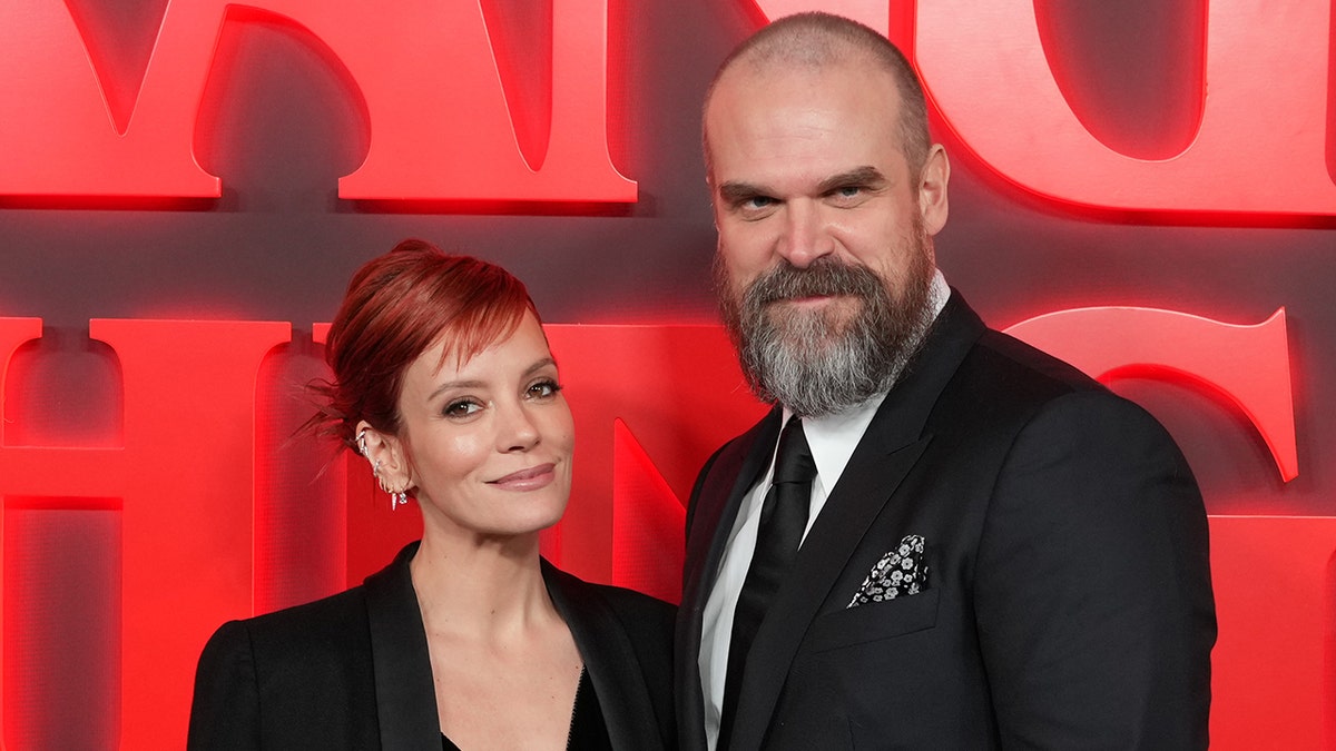 Lily Allen and David Harbour match in black at Stranger Things premiere.