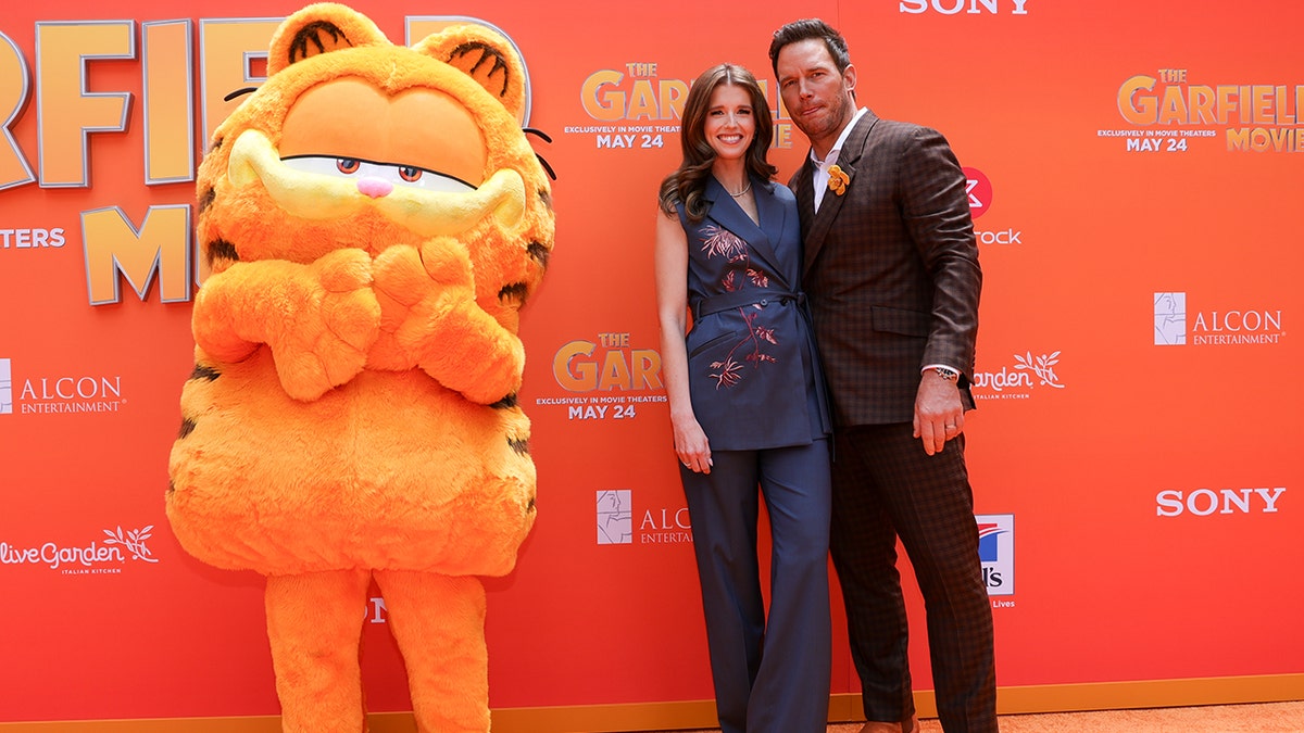 Katherine Schwarzenegger and Chris Pratt at "The Garfield Movie" premiere in custom Paul Smith outfits.