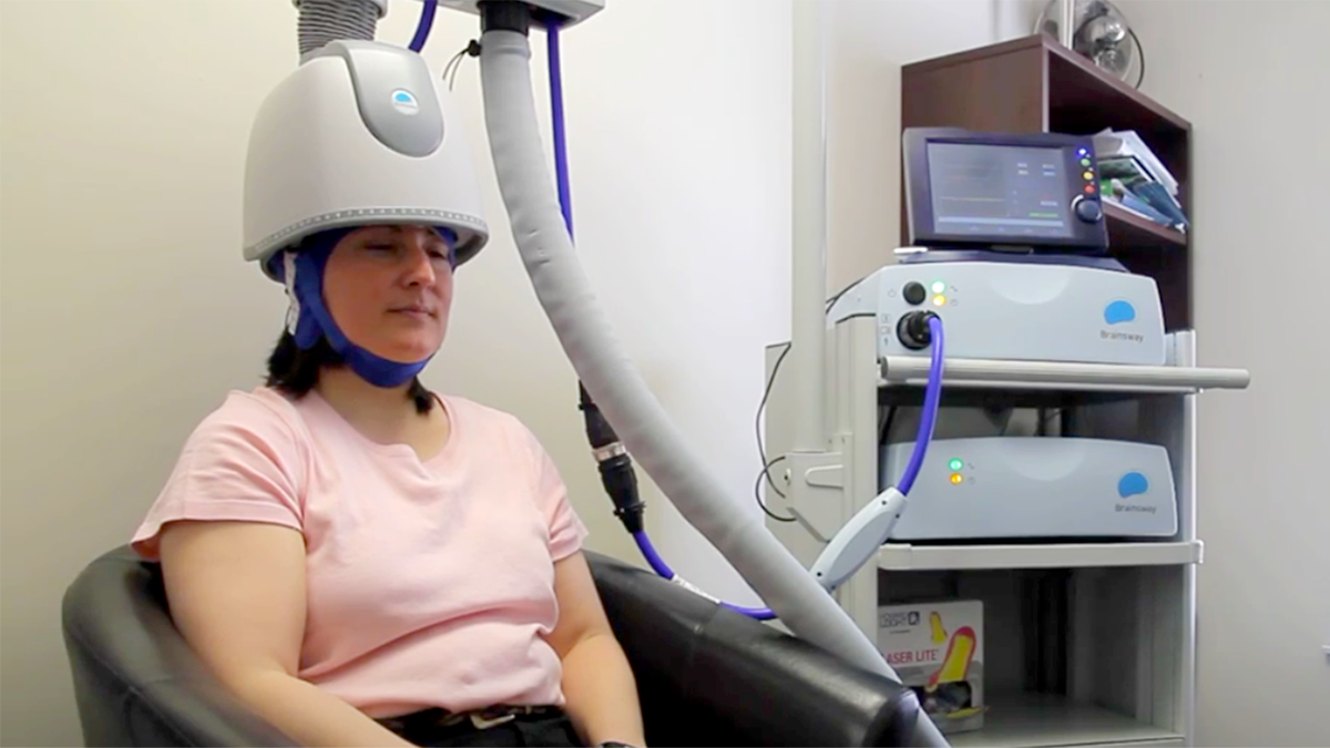 patient sits for deep tms therapy
