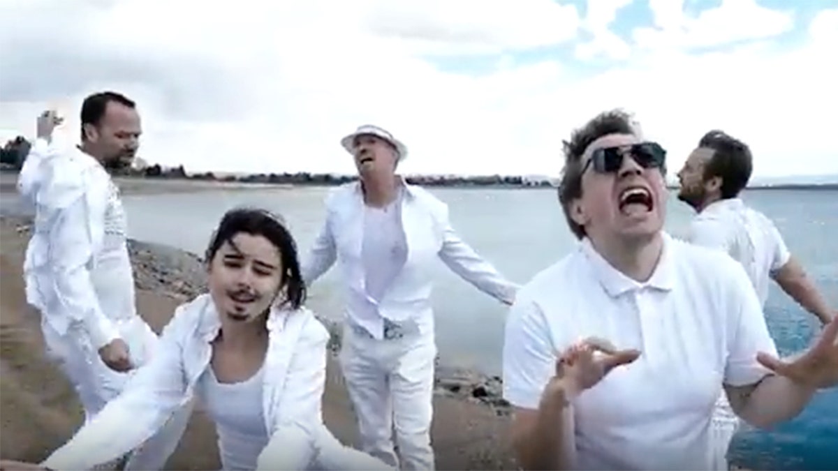 Splashstreet Boys in all white at lake