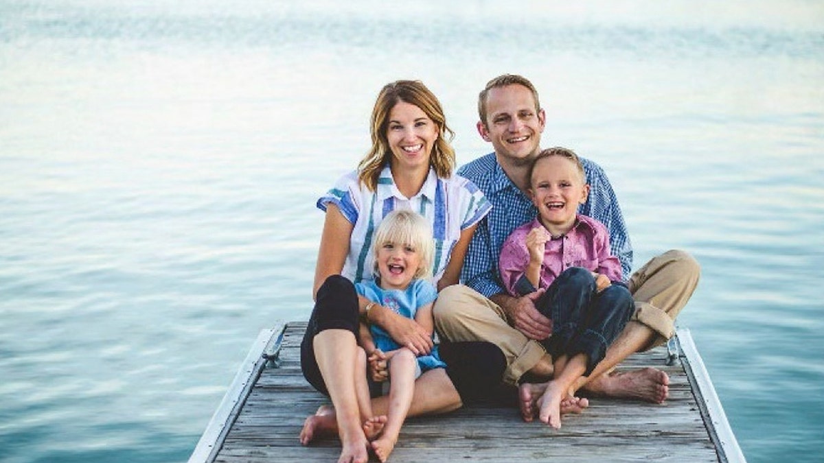 Brianne Dressen with family photo on pier