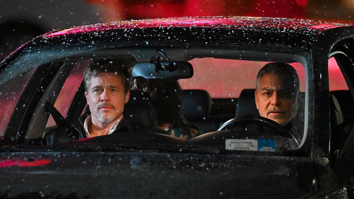 Brad Pitt and George Clooney in the car filming "Wolfs"